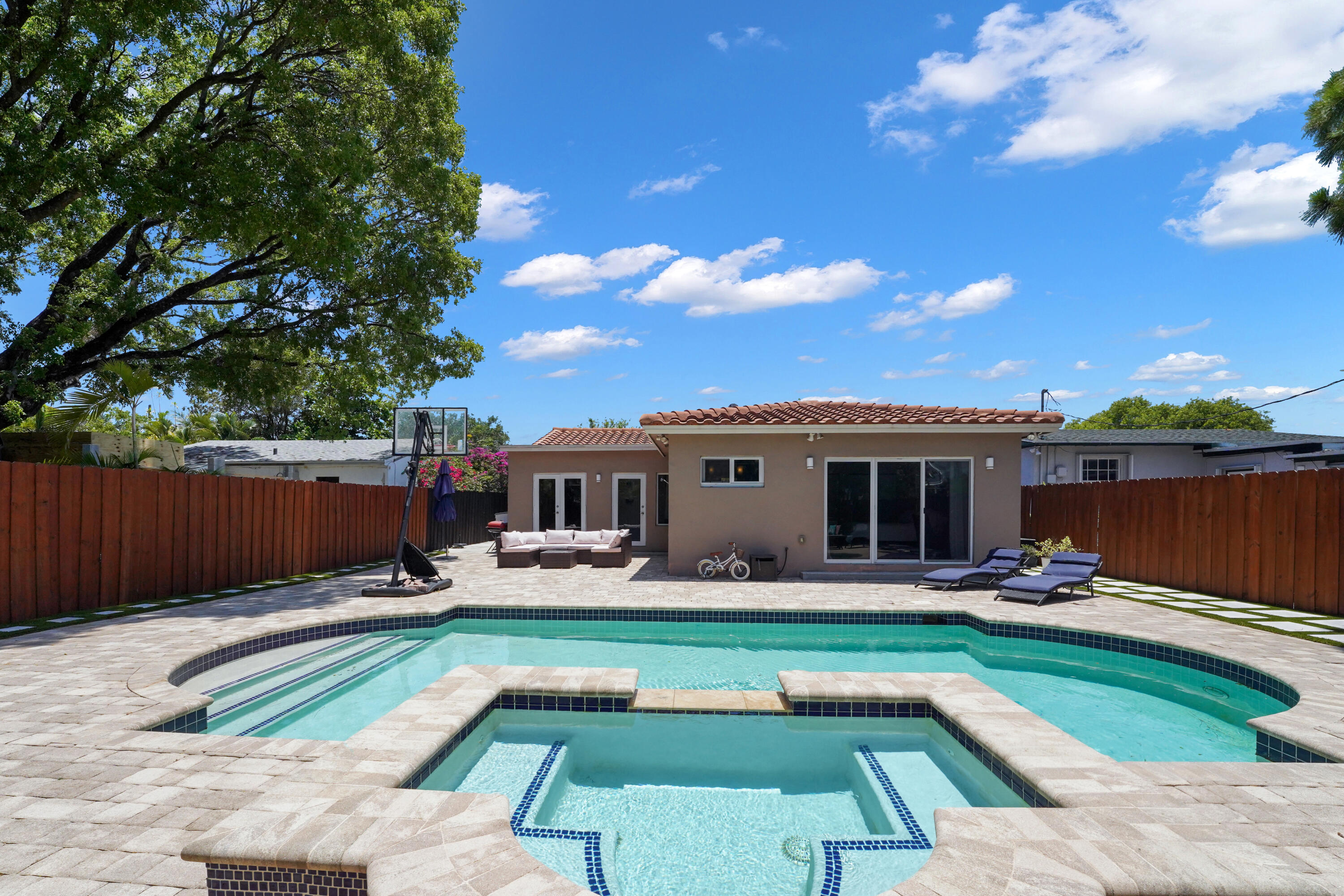 a front view of house with yard having outdoor seating