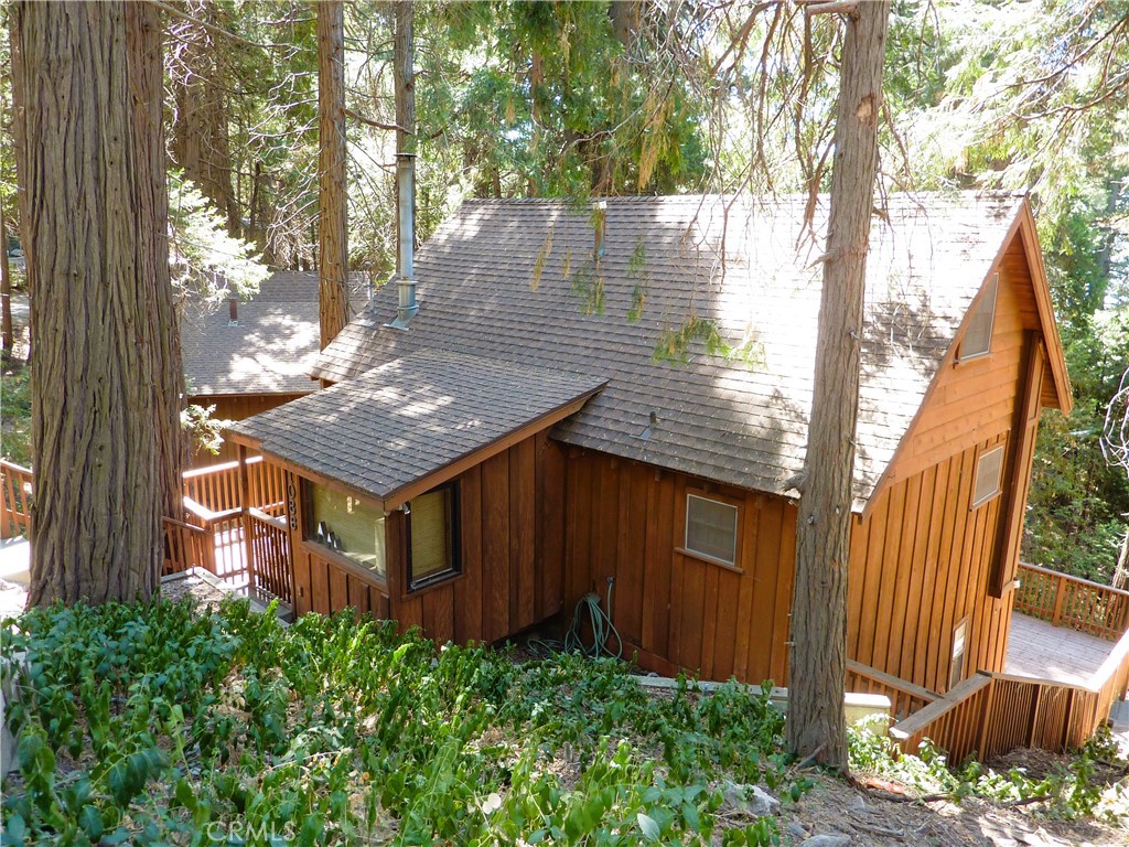 a view of a wooden fence next to a house