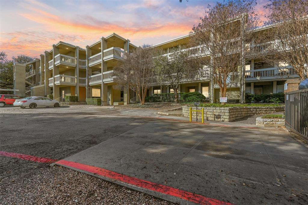 View of property at dusk