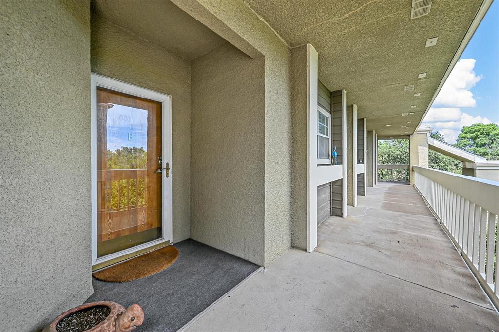 a view of a hallway with windows