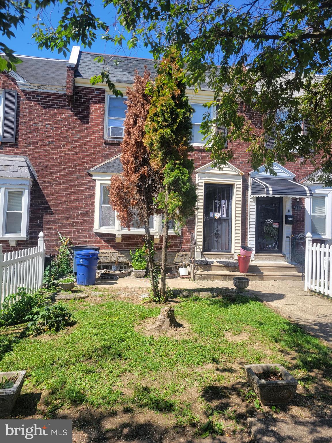 a house view with a sitting space and garden