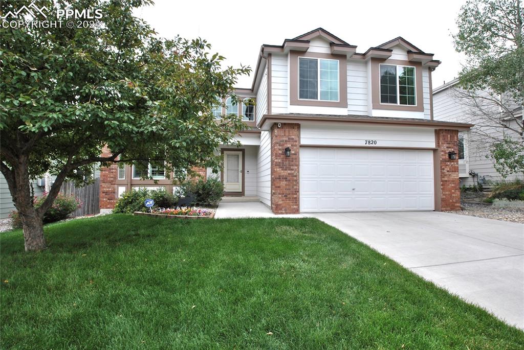 a front view of house with yard