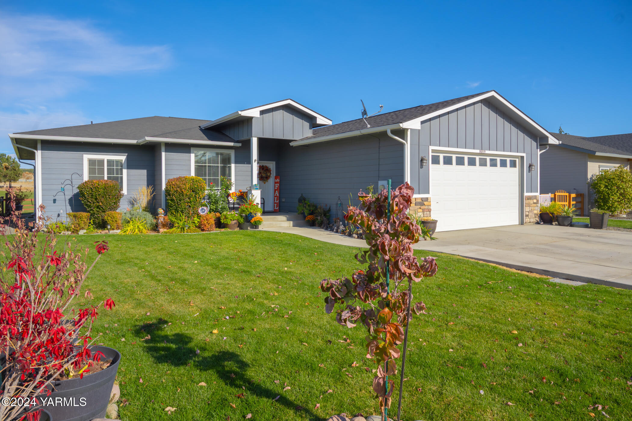 a front view of house with yard and outdoor seating