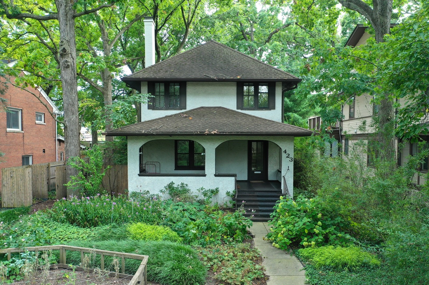 a front view of a house with garden