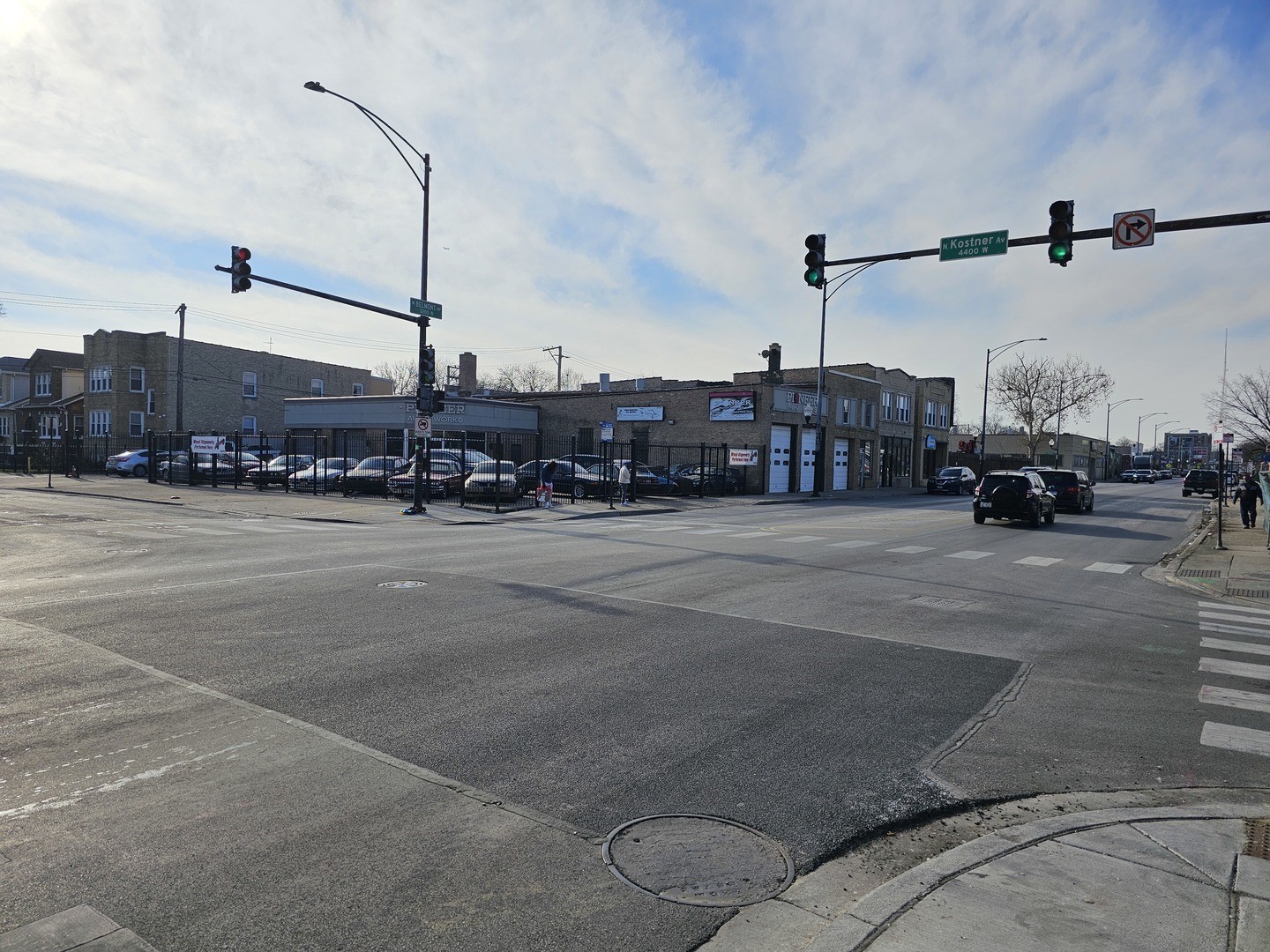 a view of a city street with cars