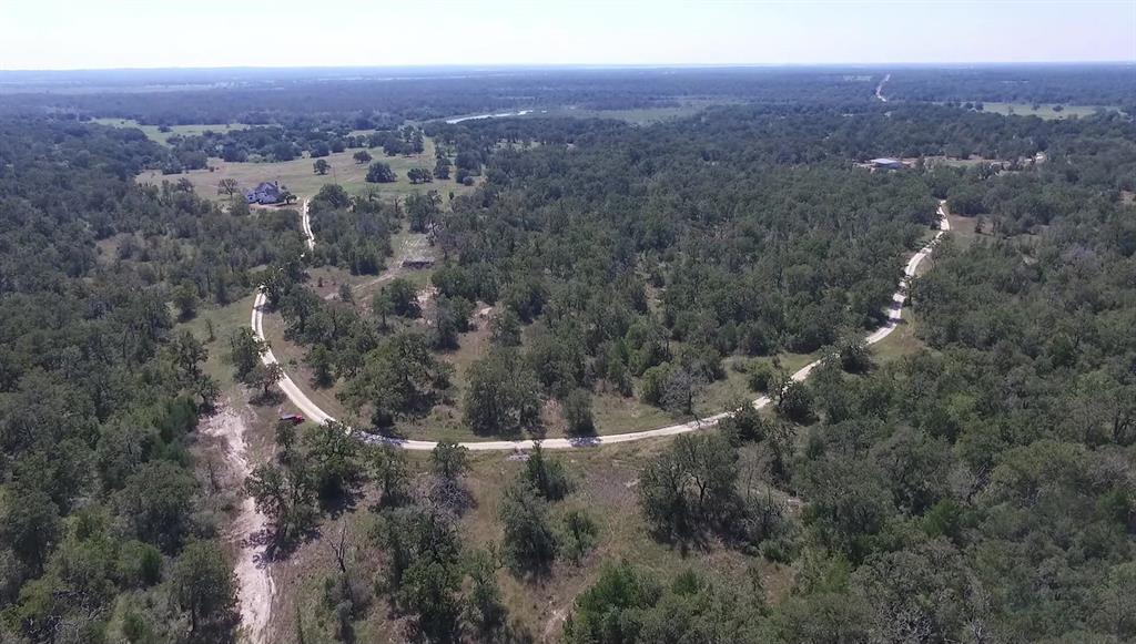 an aerial view of residential house and green space