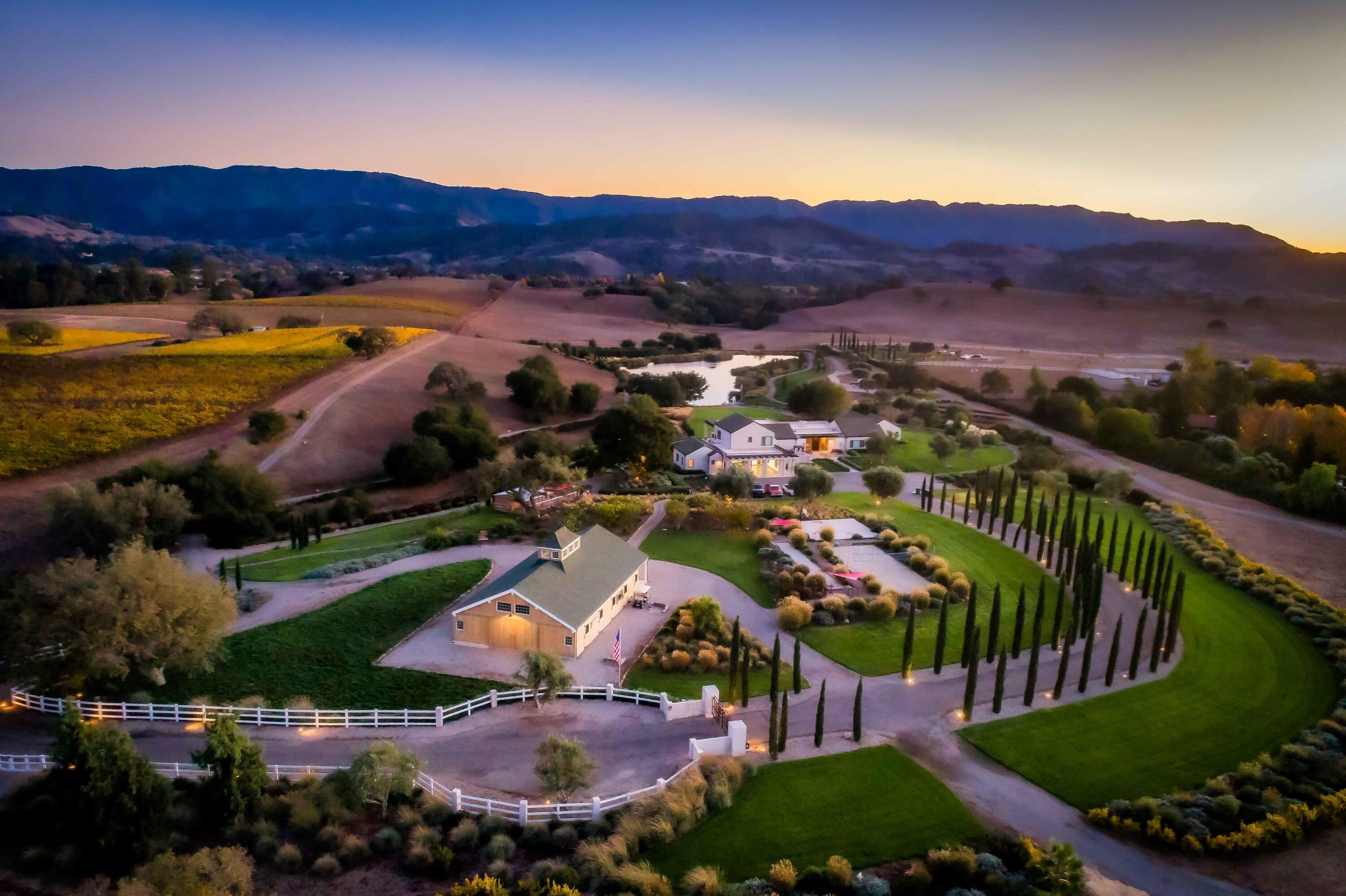 an aerial view of residential houses and outdoor space