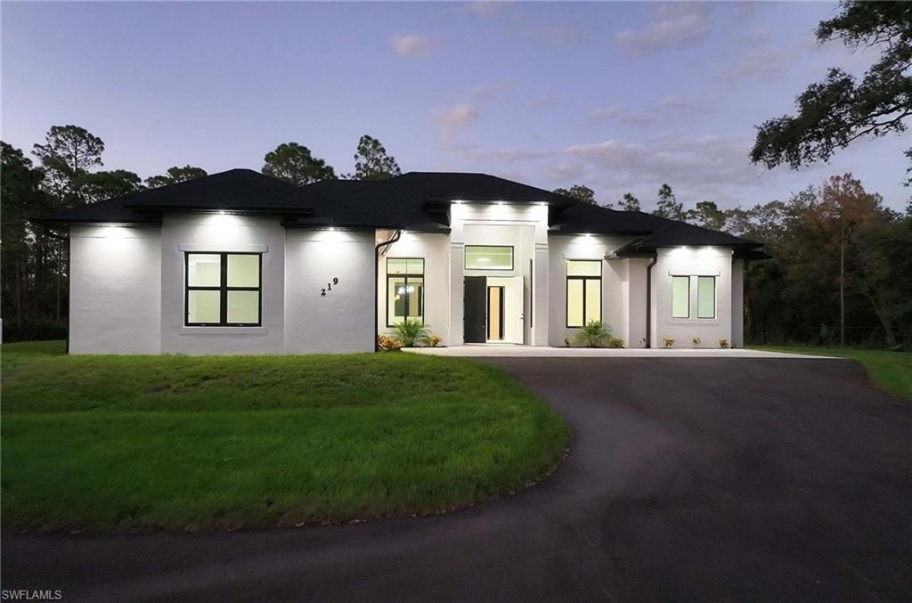 View of front of house with a yard