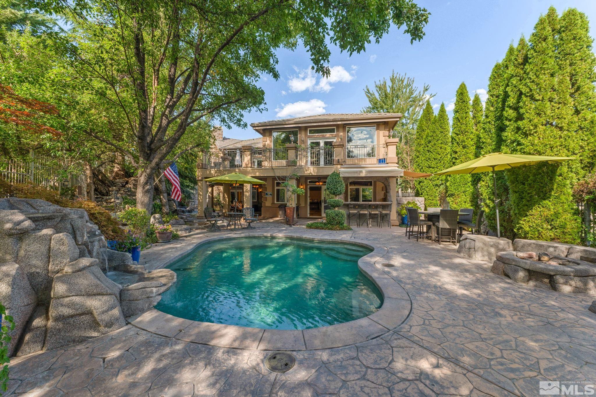 a view of a house with swimming pool