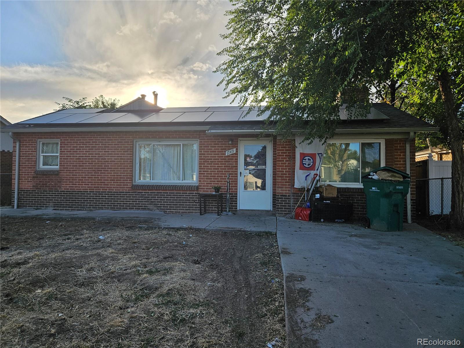 a view of a house with a yard and garage