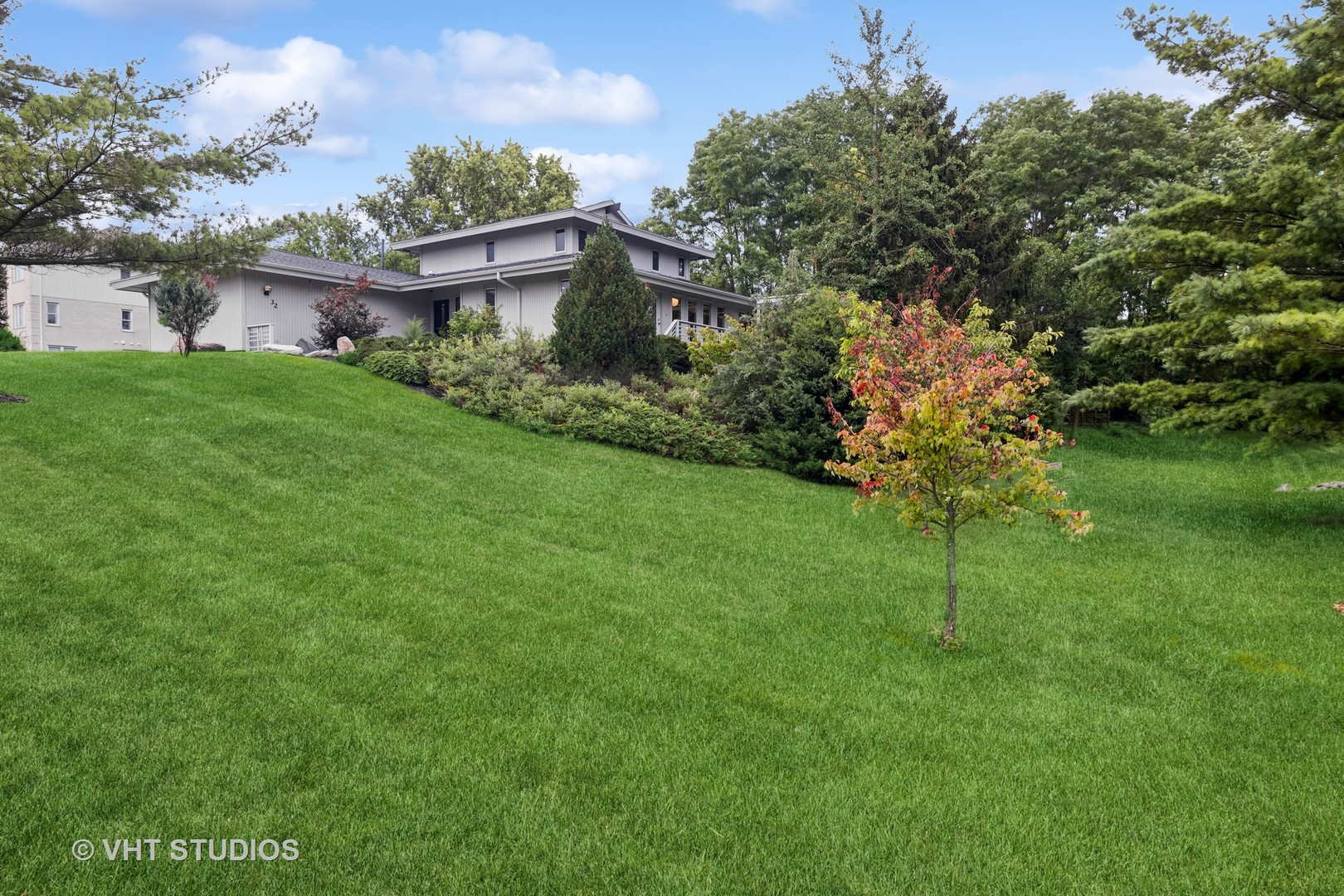 a backyard of a house with lots of green space