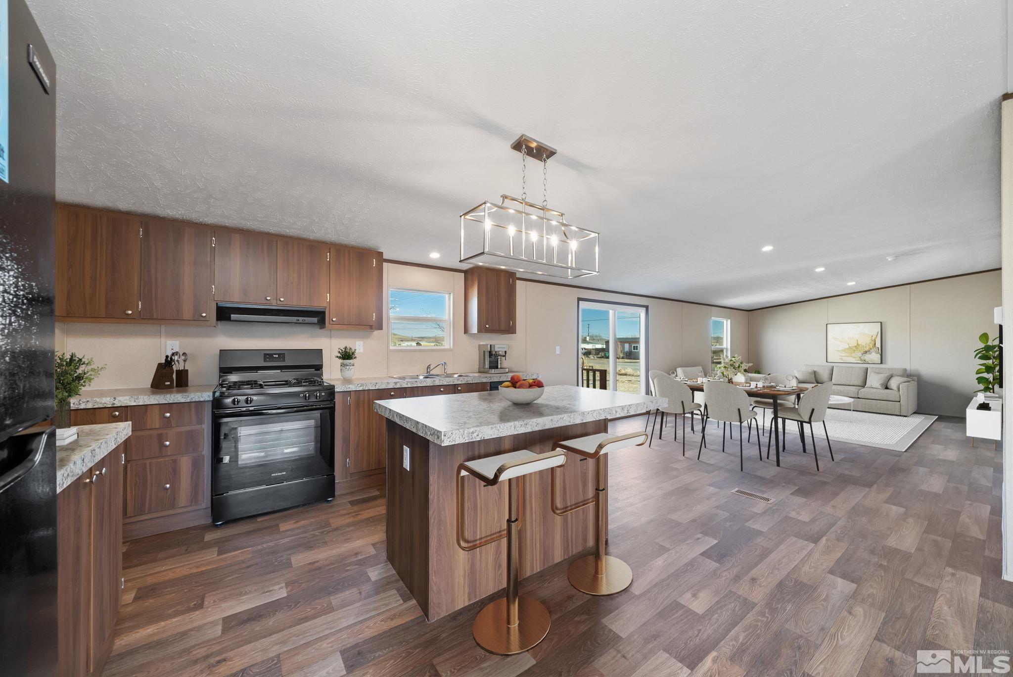 a kitchen with lots of counter top space and dining table