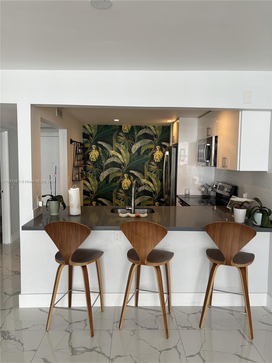 a view of a dining room with furniture