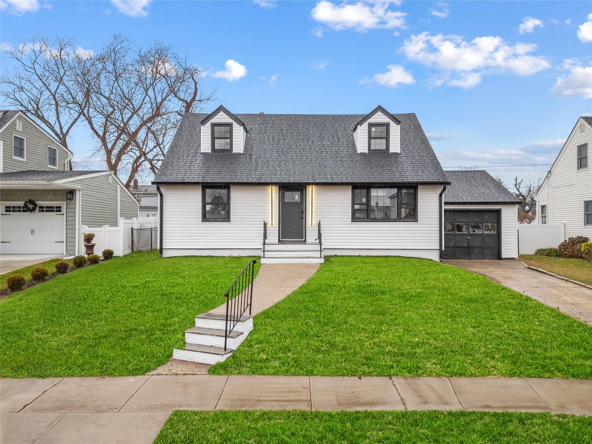 View of front of house with a front yard