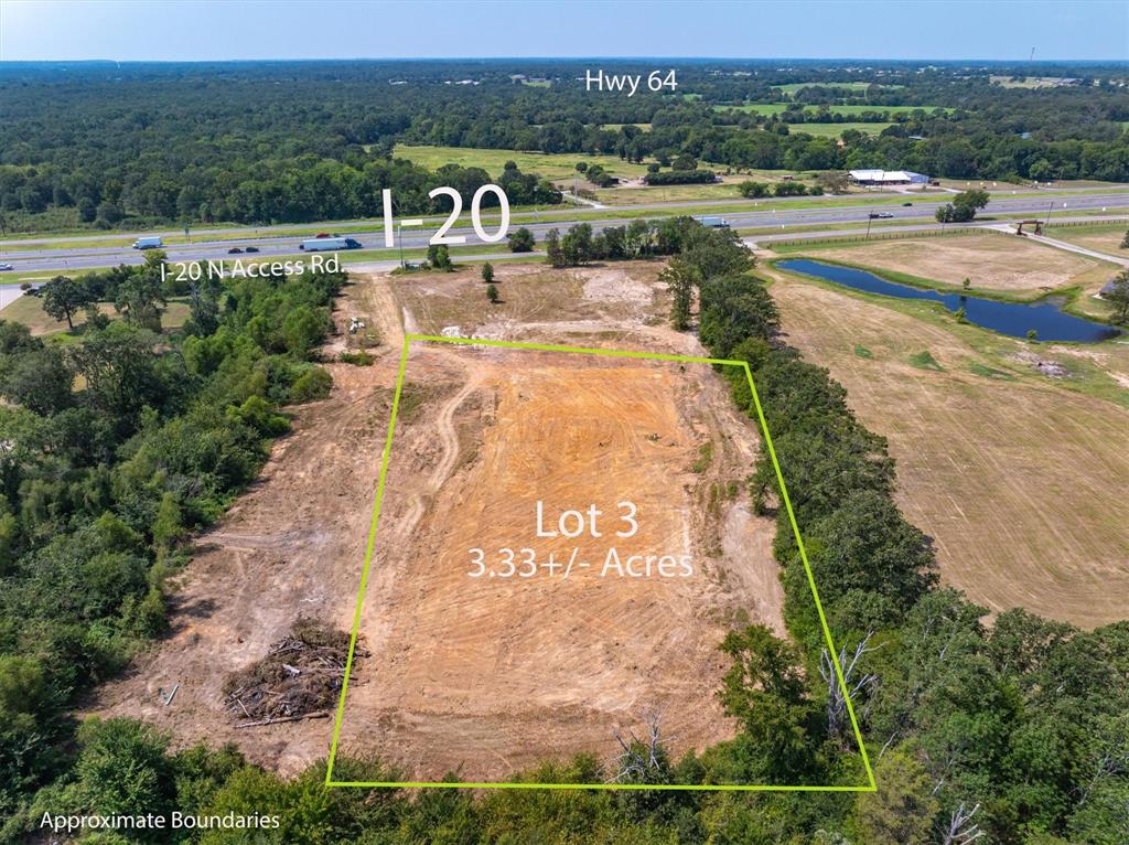 an aerial view of a house with big yard