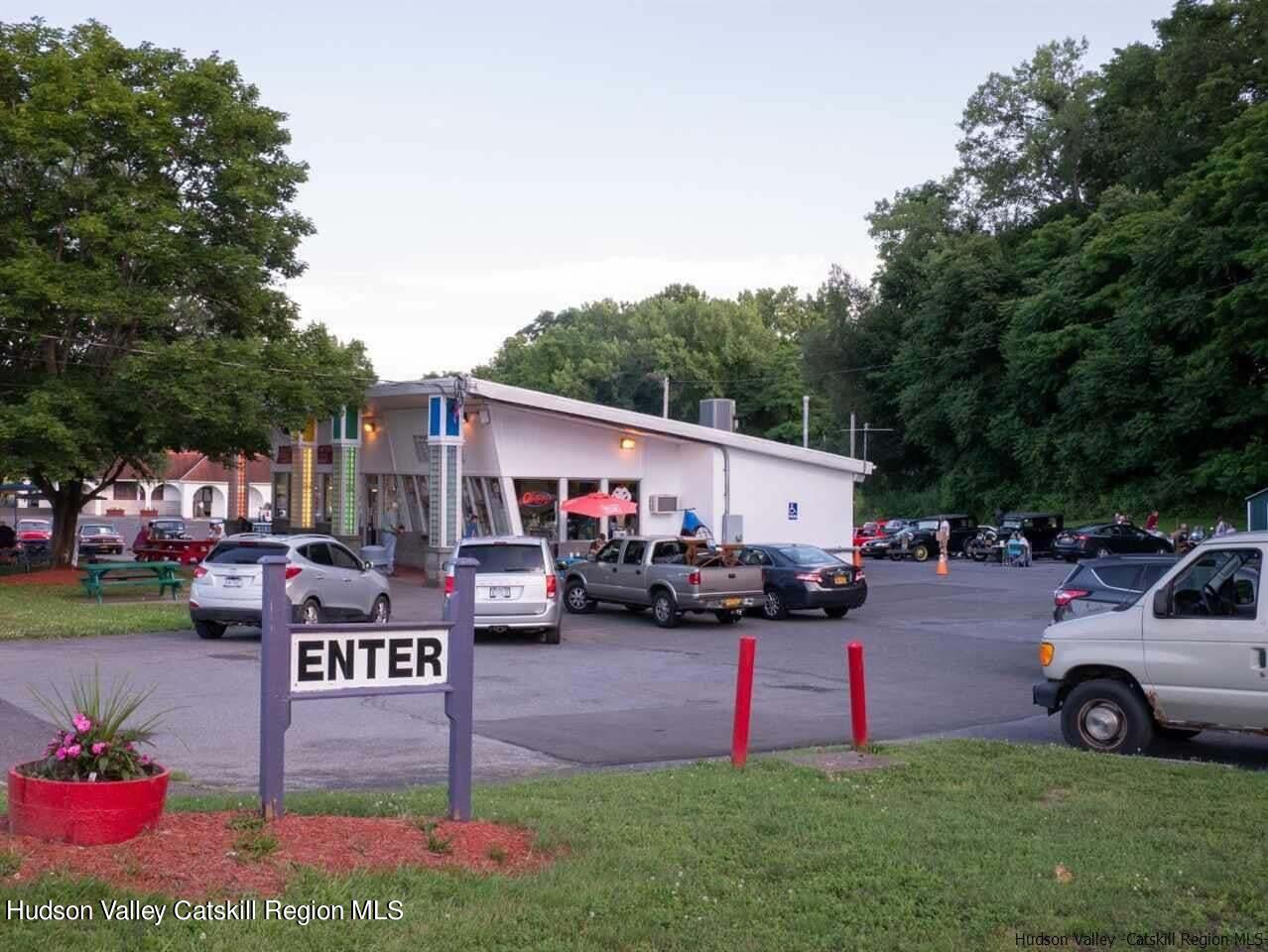 a view of a yard with cars