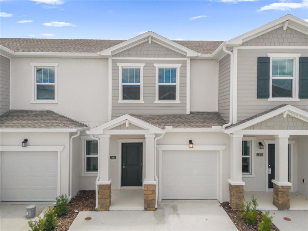 a front view of a house with a garage