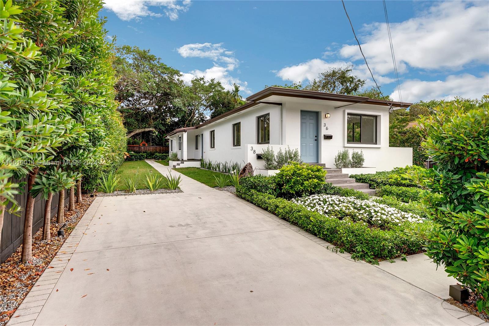 front view of a house with a yard