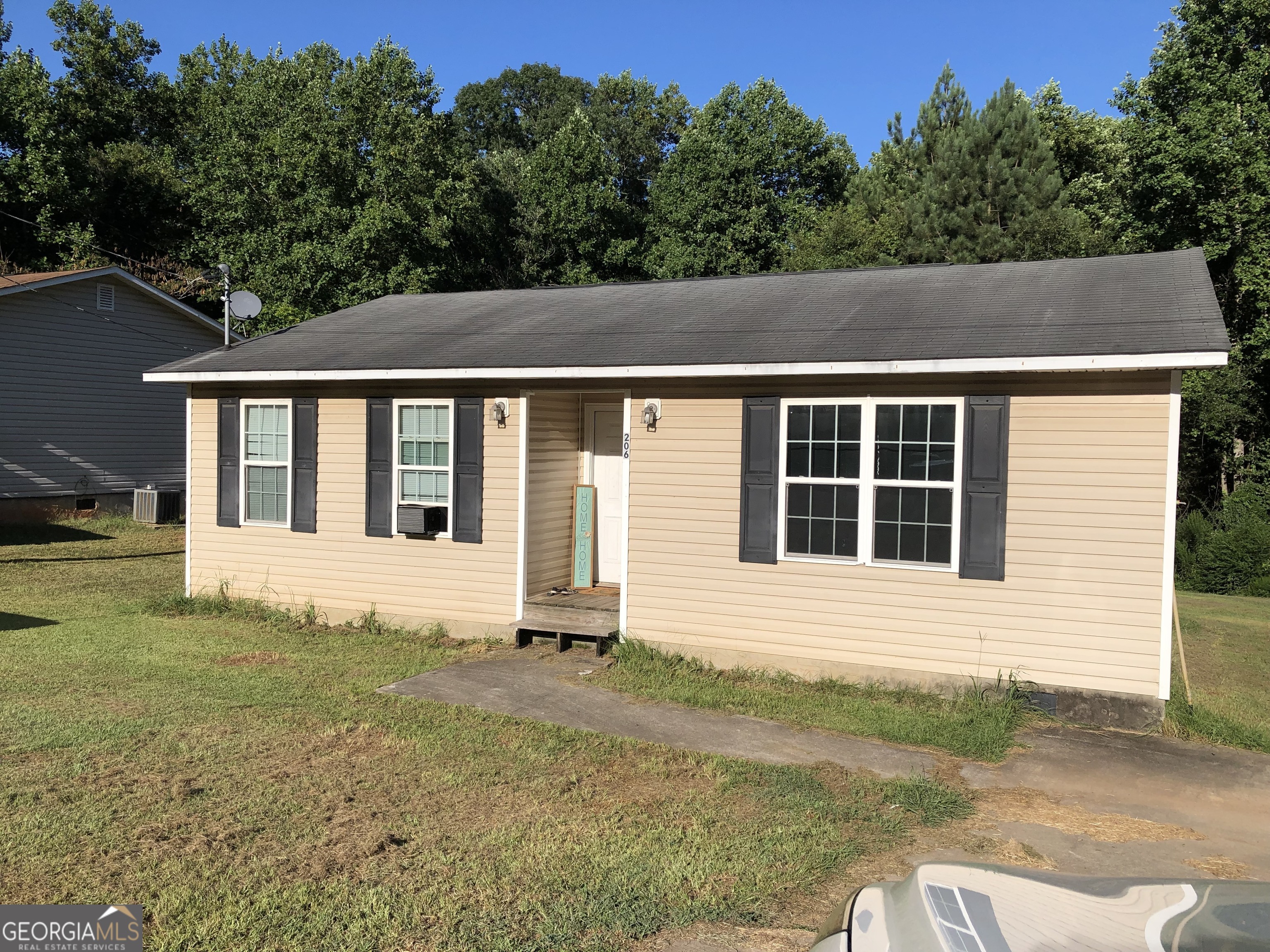 a view of house with backyard