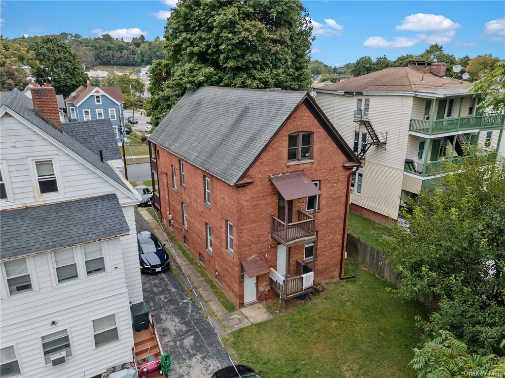 a aerial view of a house with a yard