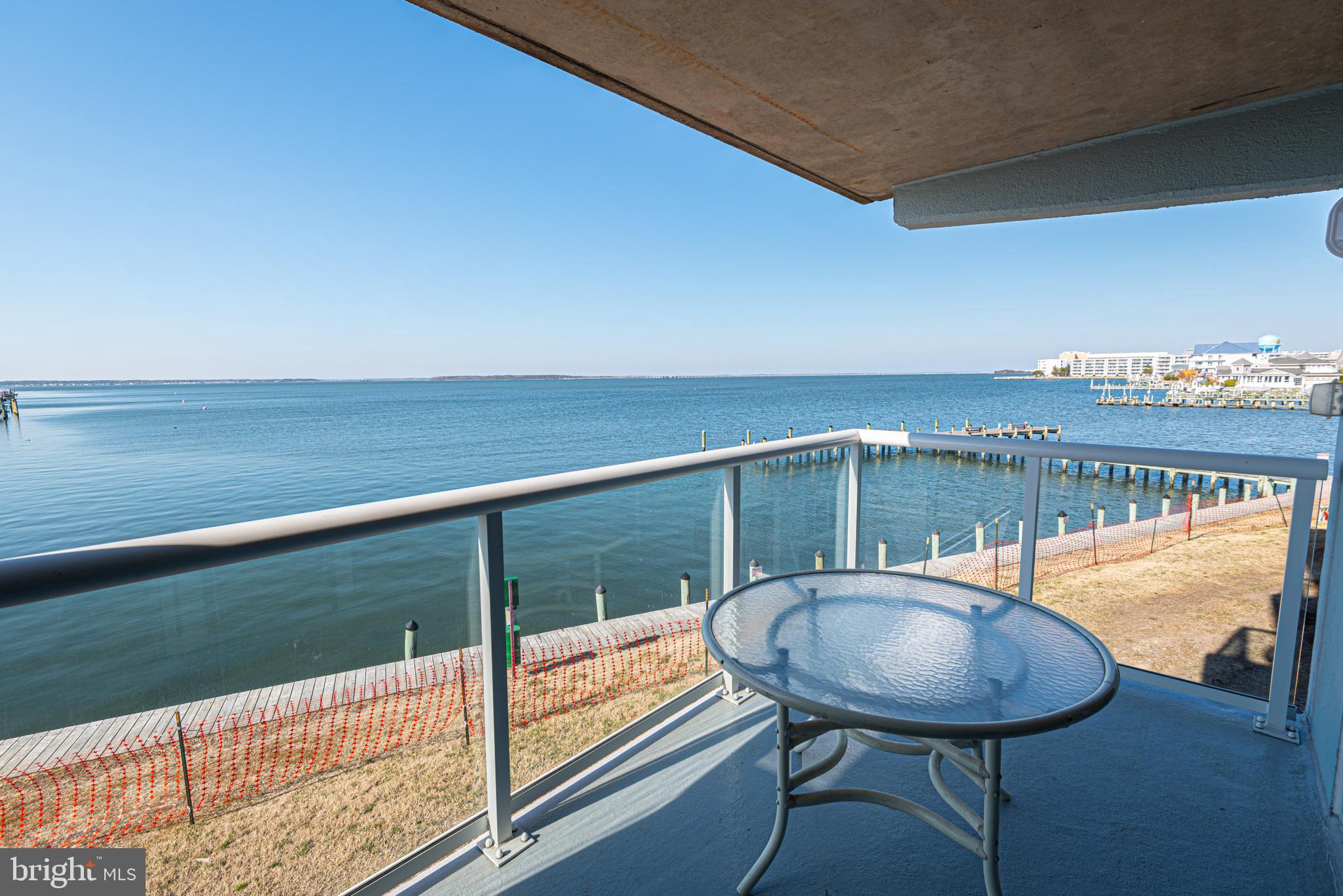 a balcony with table and chairs