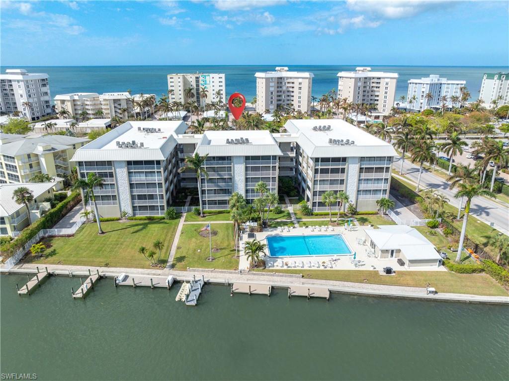 Birds eye view of property featuring a water view