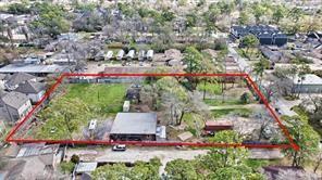 an aerial view of a houses with yard