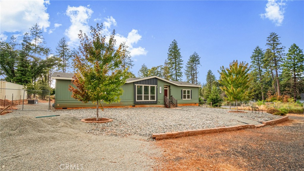 a house with a tree in front of it