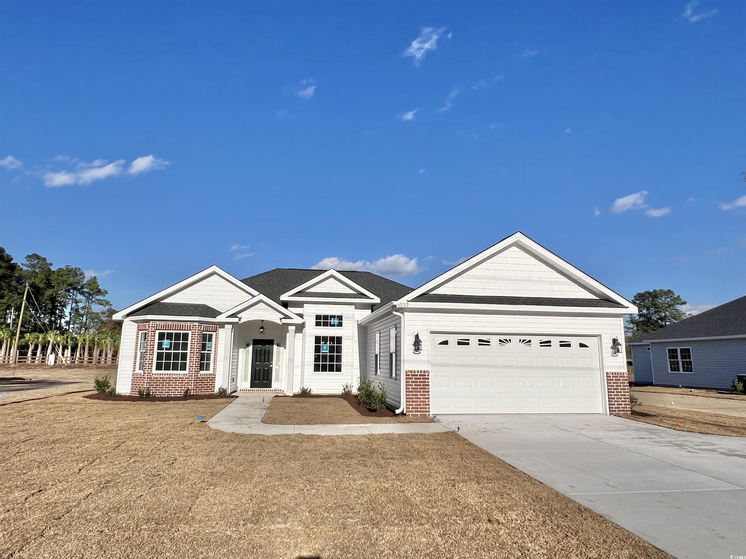 View of front of property with a garage