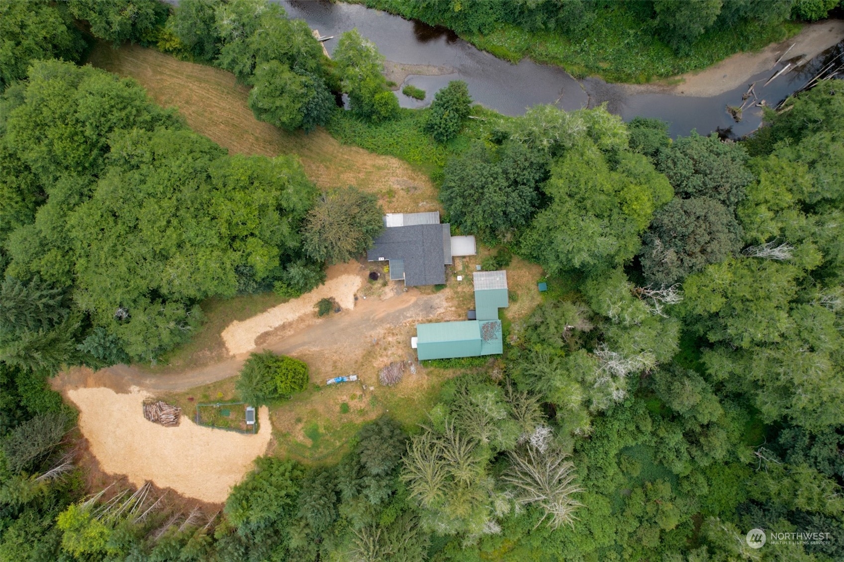 an aerial view of a house with a yard