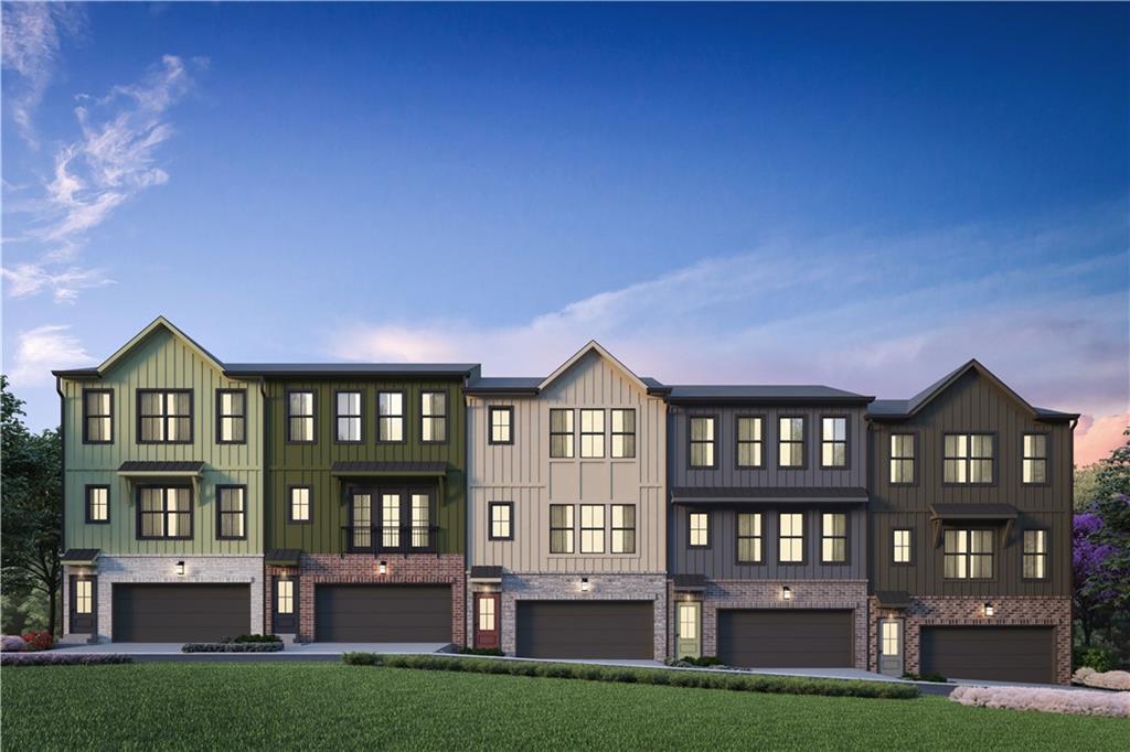 a front view of residential houses with yard and outdoor space