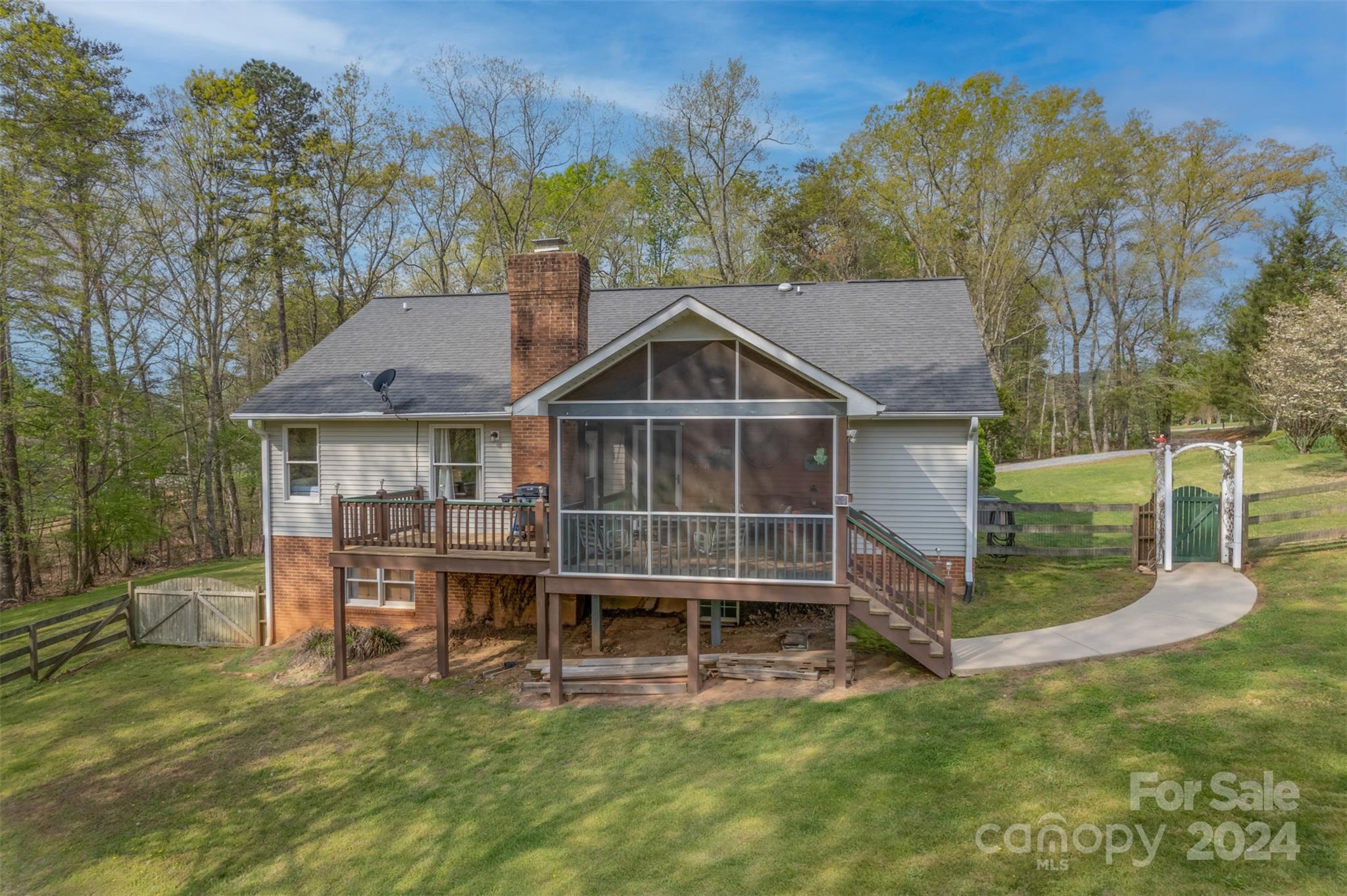 a view of a house with a yard and sitting area