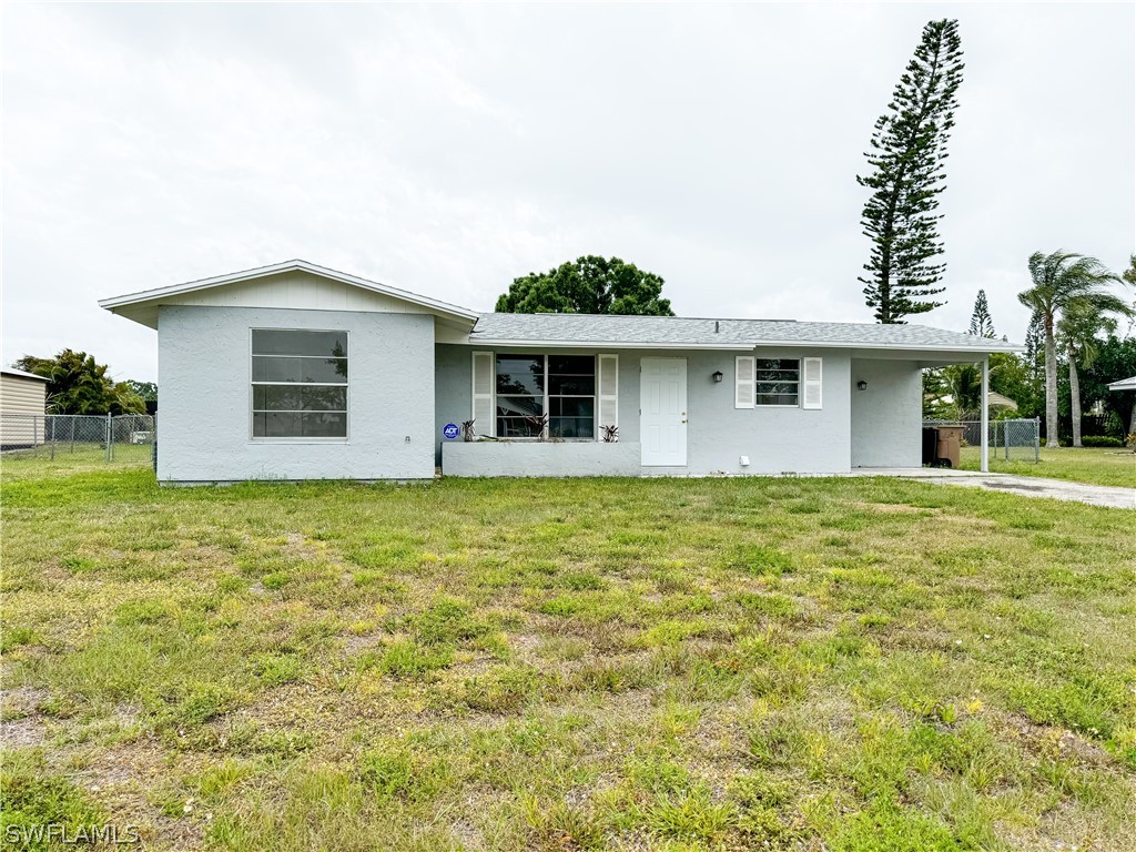 a front view of a house with yard