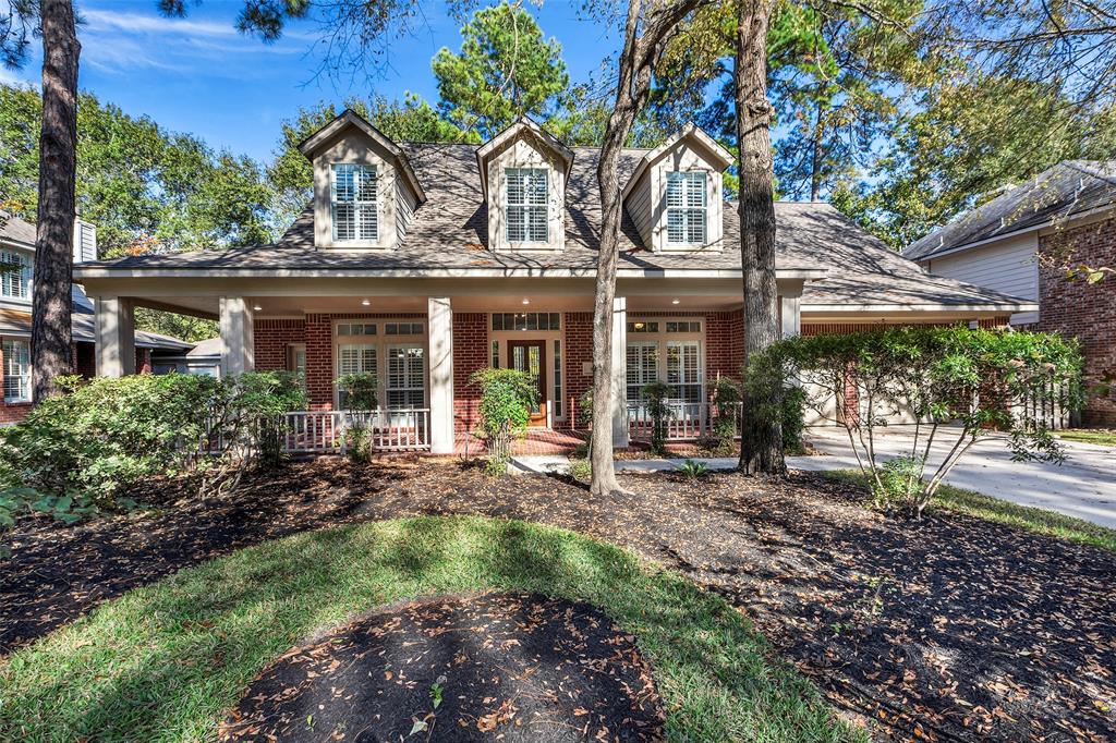 Welcome Home to 83 N Greenvine Circle located in the heart of The Woodlands. The dormer windows and covered front porch exudes charm.