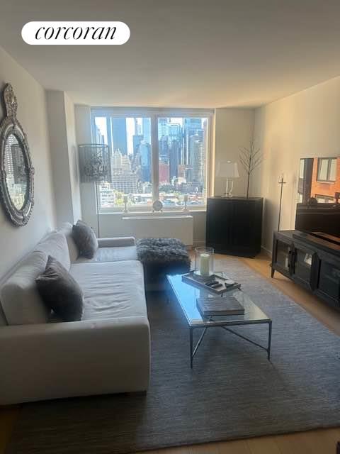 a living room with furniture and a flat screen tv