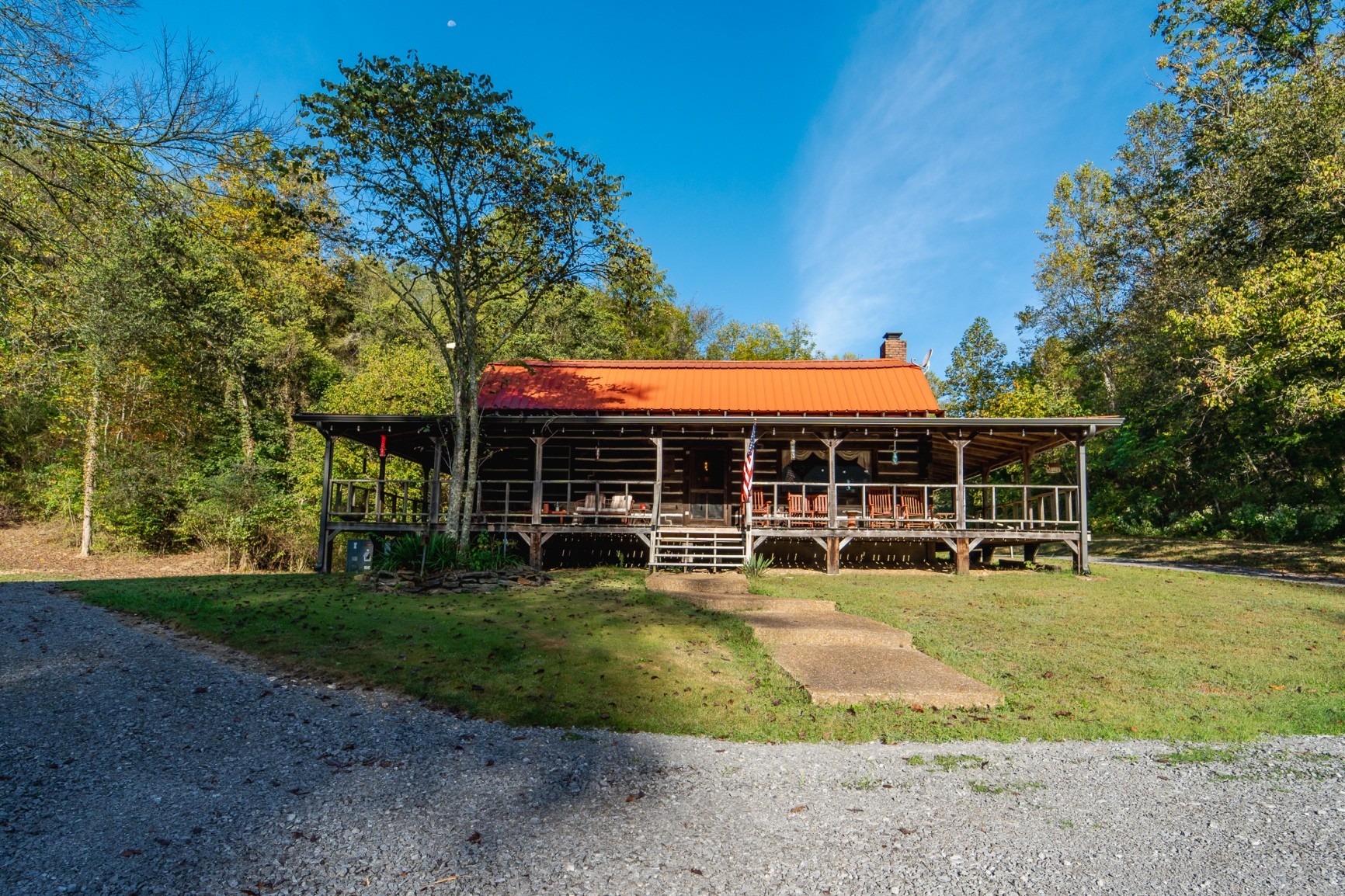 a view of a house with garden and sitting area