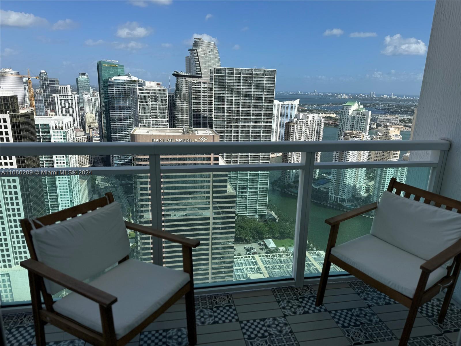 a view of a balcony with two chairs