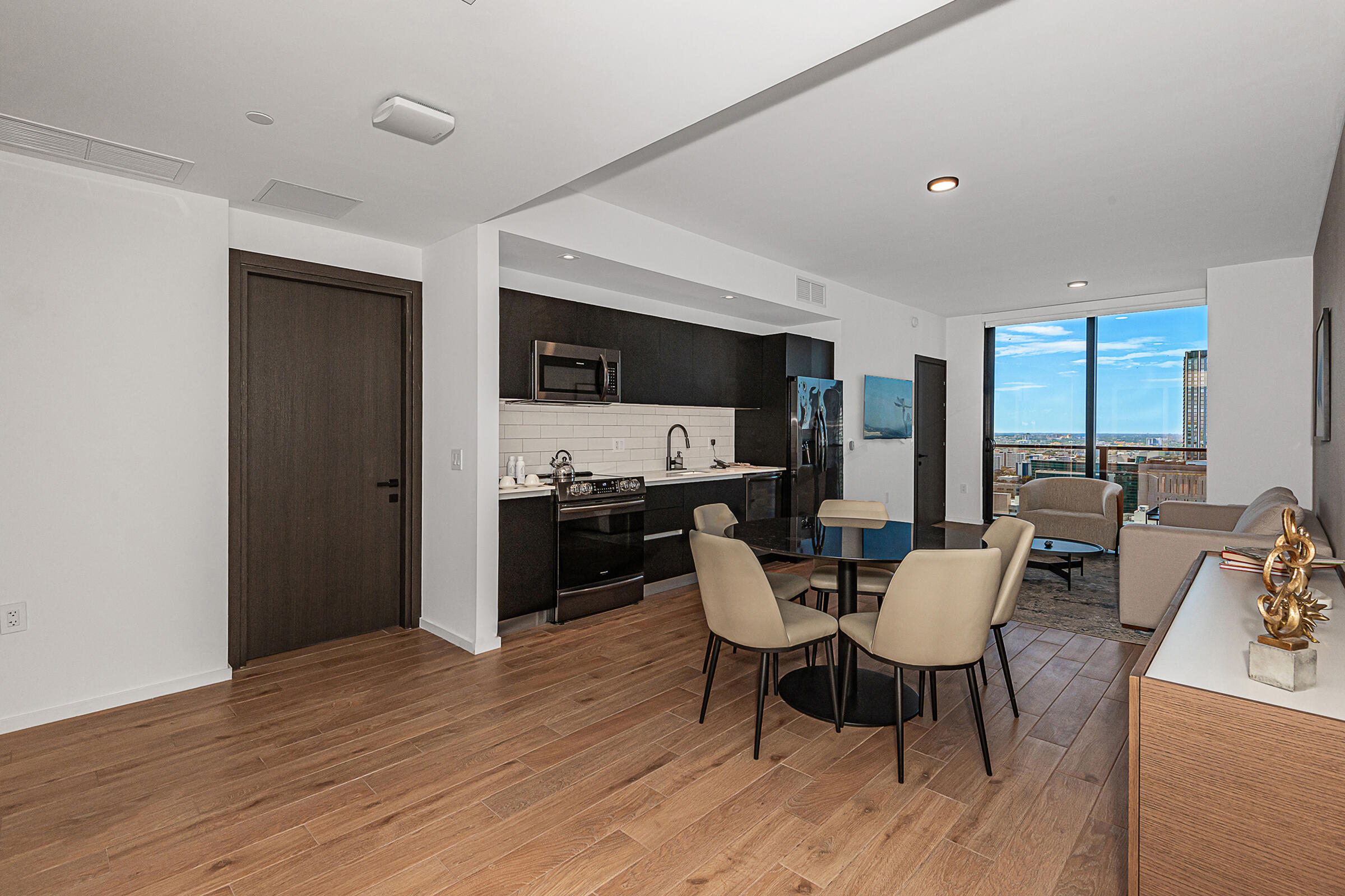 a view of a dining room with furniture window and wooden floor