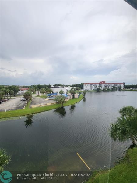 a view of a lake with houses in the back