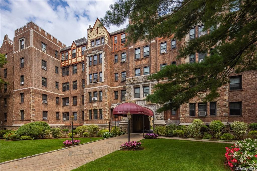 a front view of a building with garden