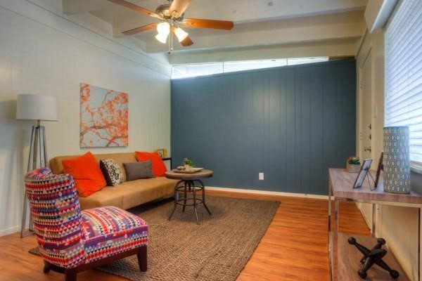 a living room with furniture and a rug