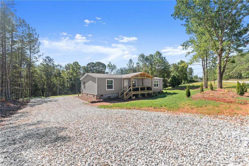 a house with trees in the background