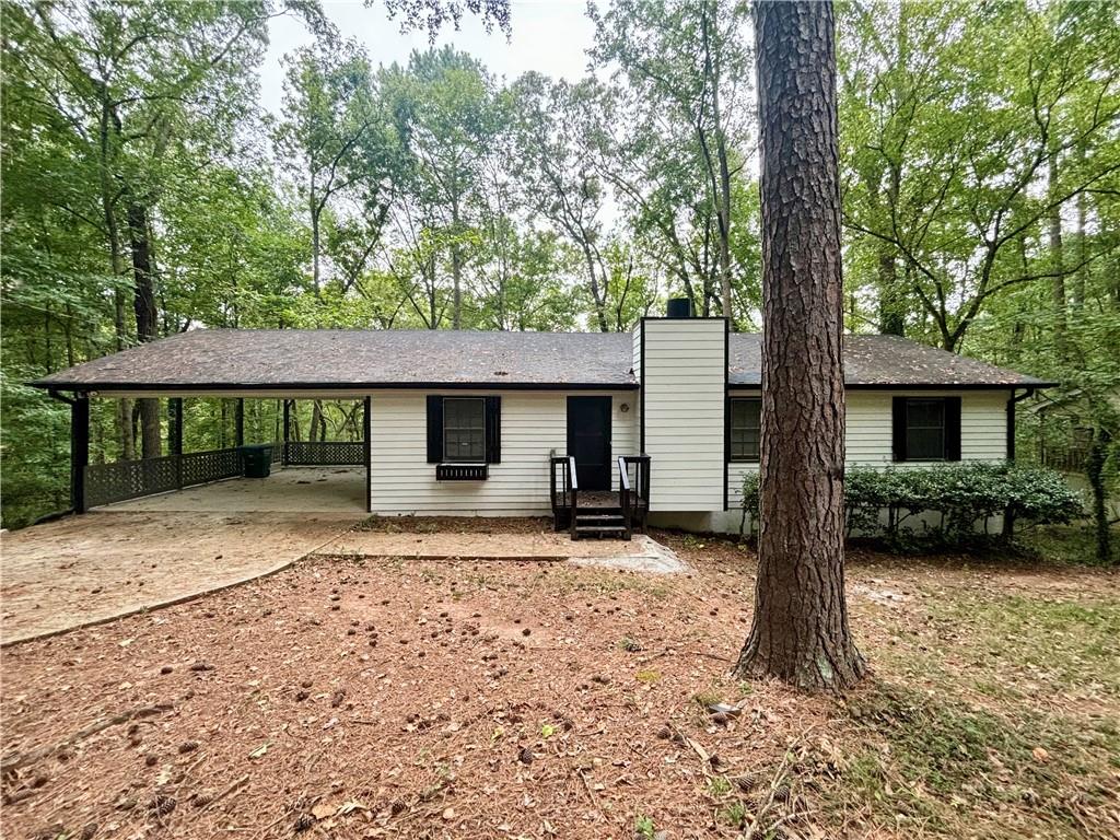 a front view of a house with a yard and a garage