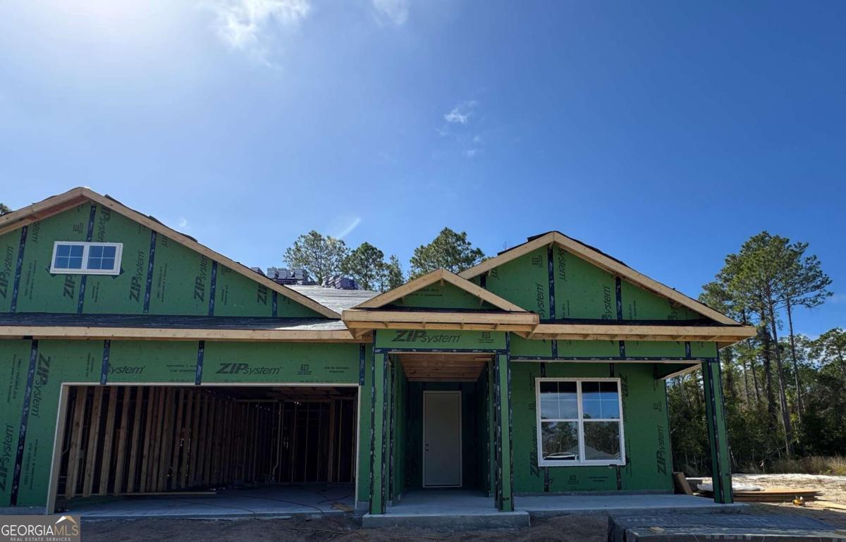 a front view of a house with garage