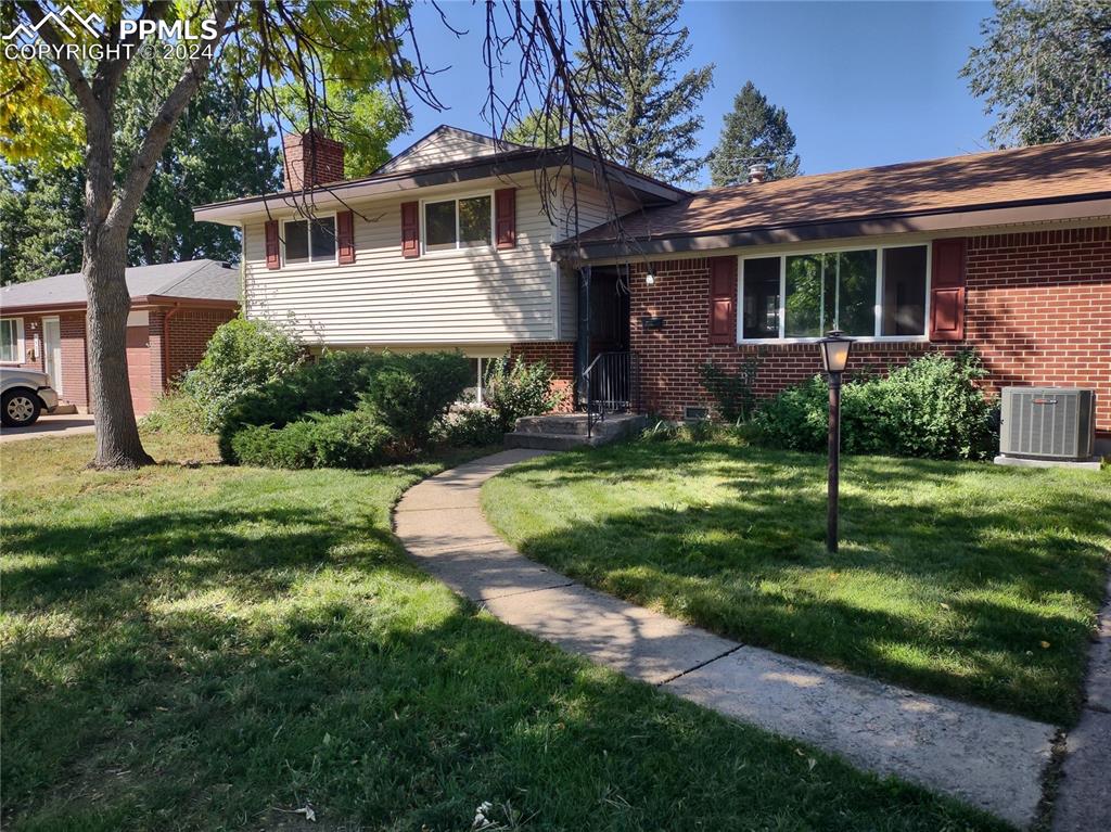 Tri-level home with central AC and a front yard