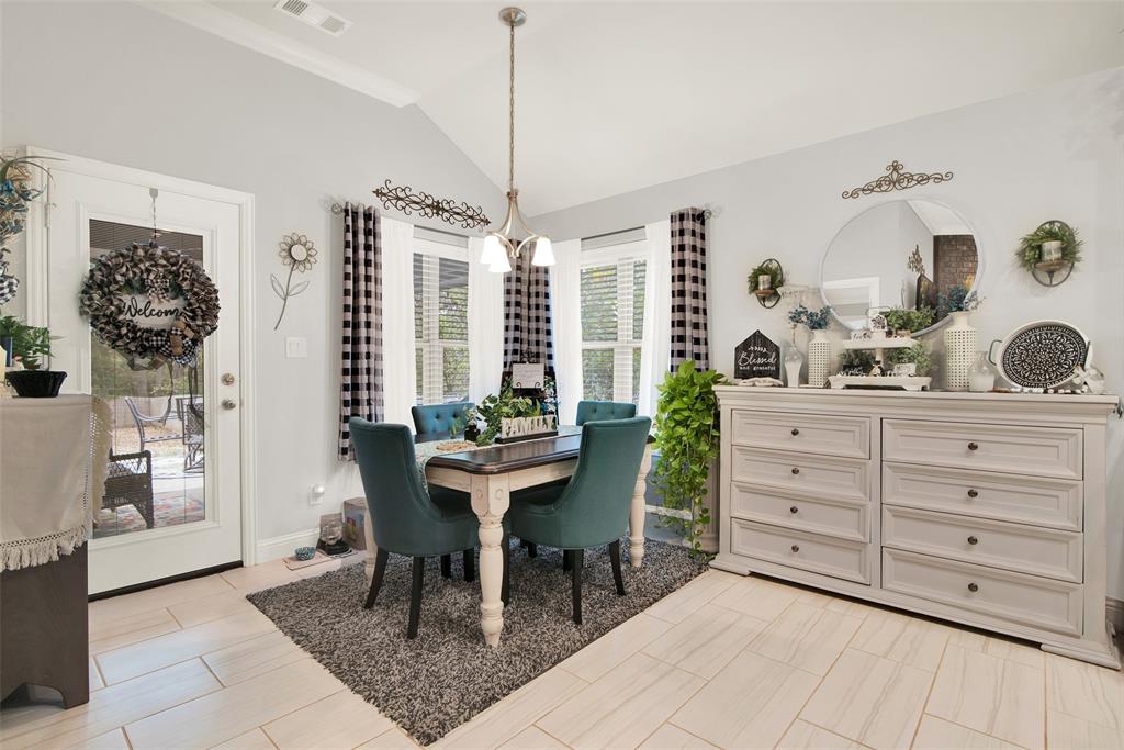 a dining room with a table chairs and a living room