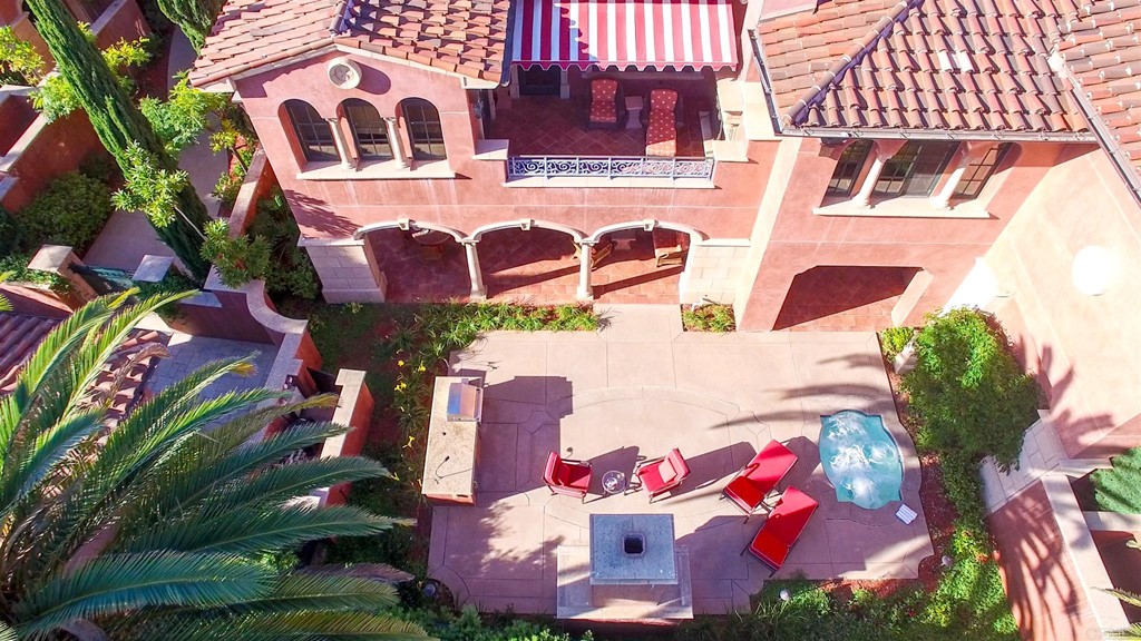 an aerial view of a house with yard