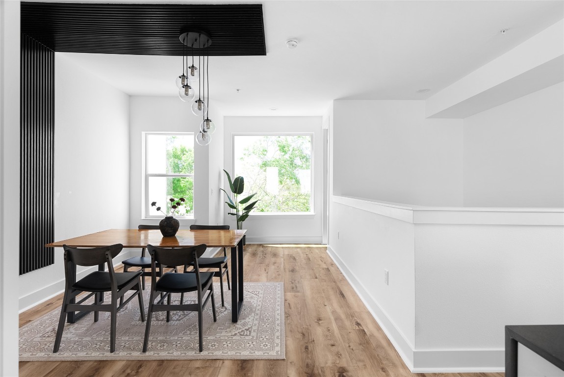 a view of a dining room with furniture and window