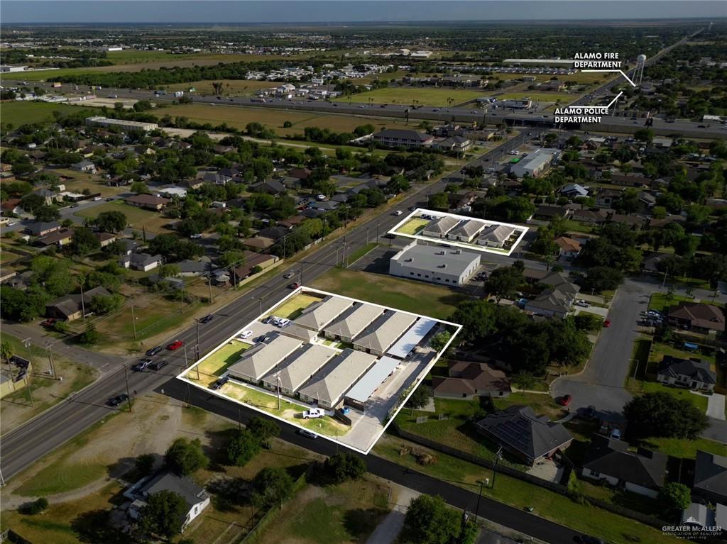 an aerial view of residential houses with outdoor space