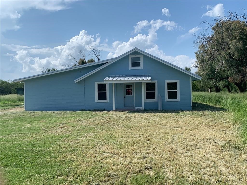 a house with yard in front of it